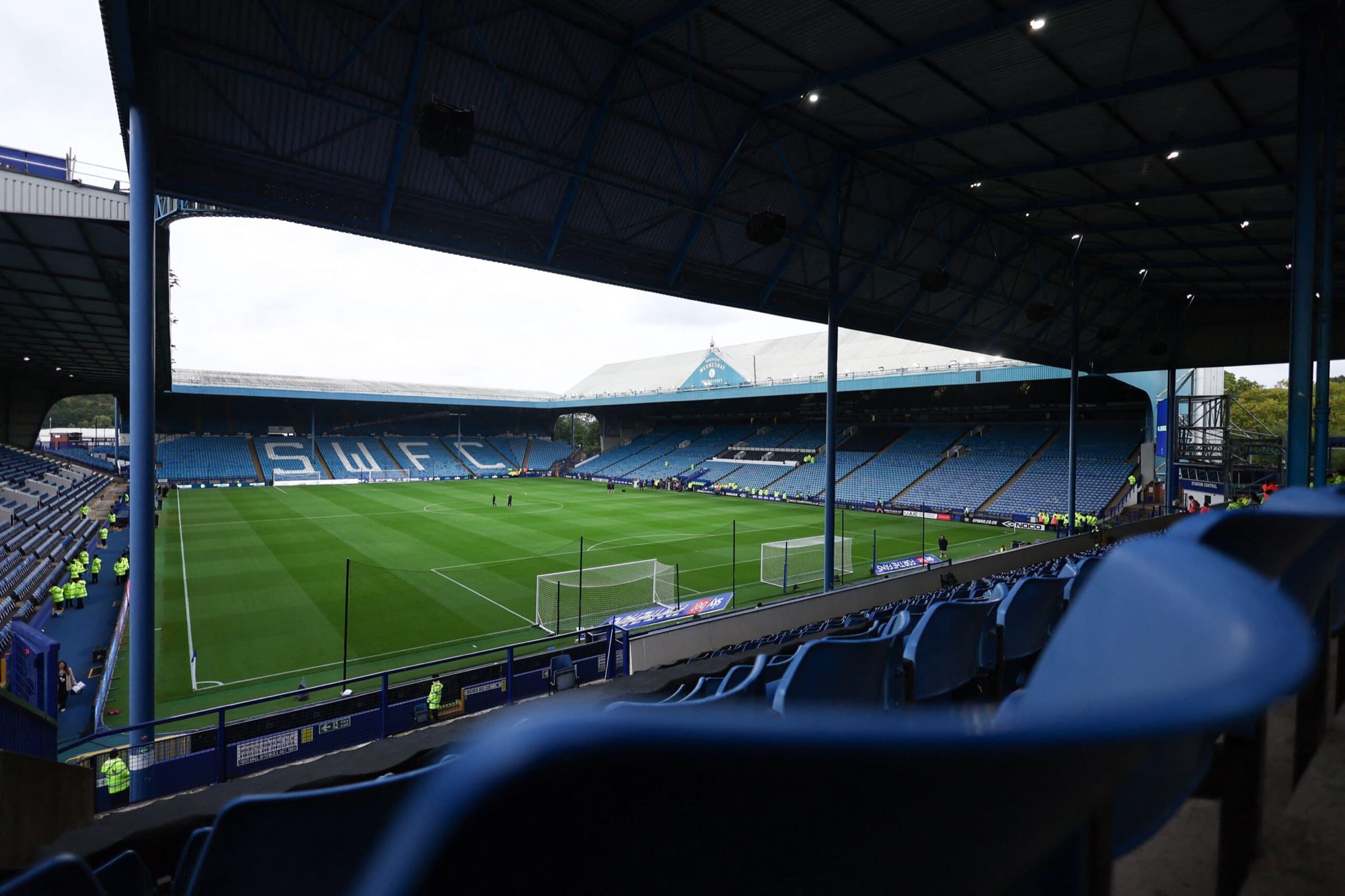 An empty stand at a football ground before the gates open, seen from the seats